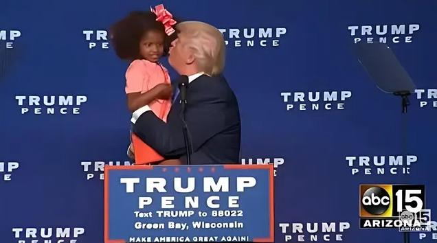 Trump kissing little Black girl - screenshot