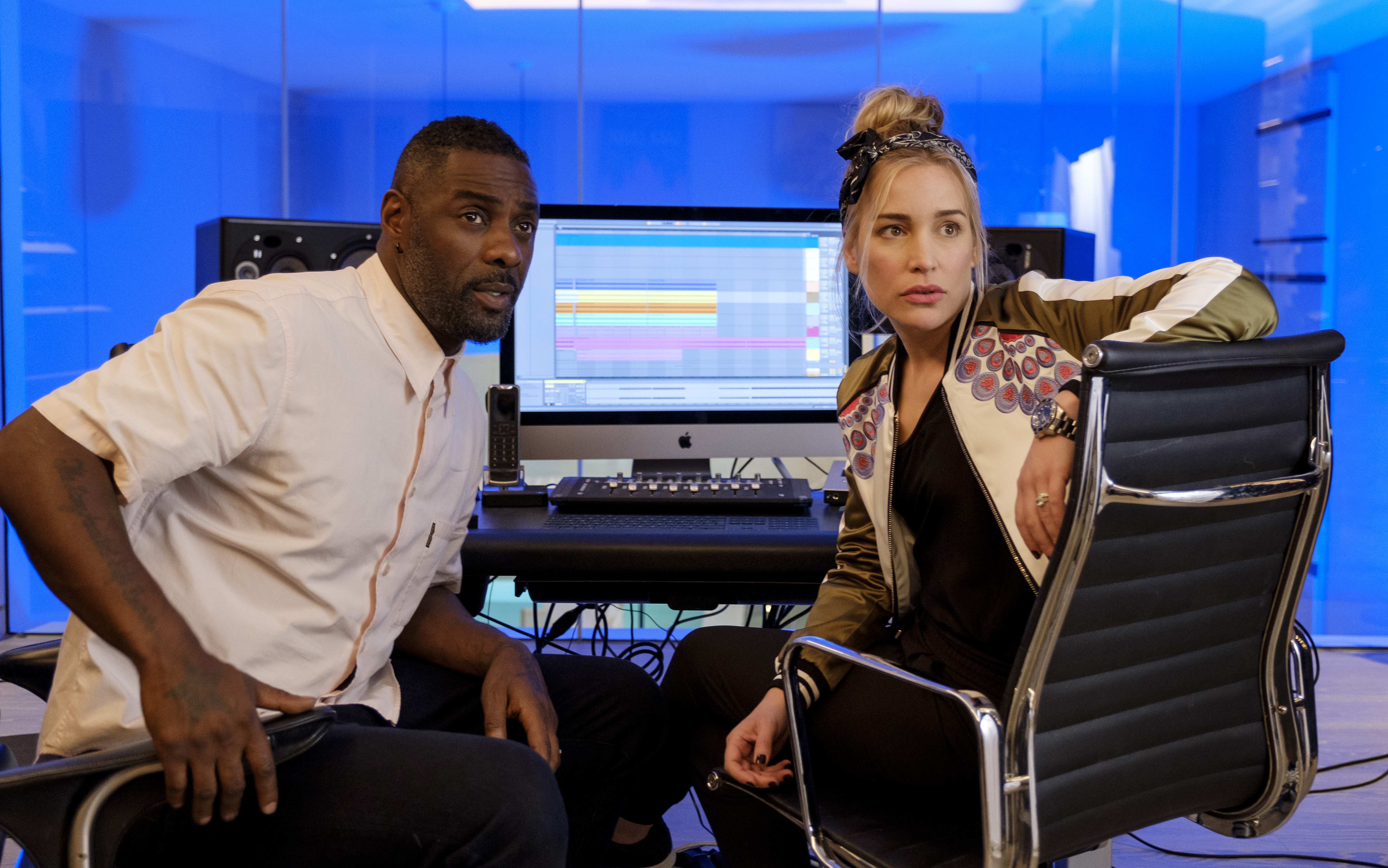 Idris Elba and Piper Perabo in Turn Up Charlie (Netflix)
