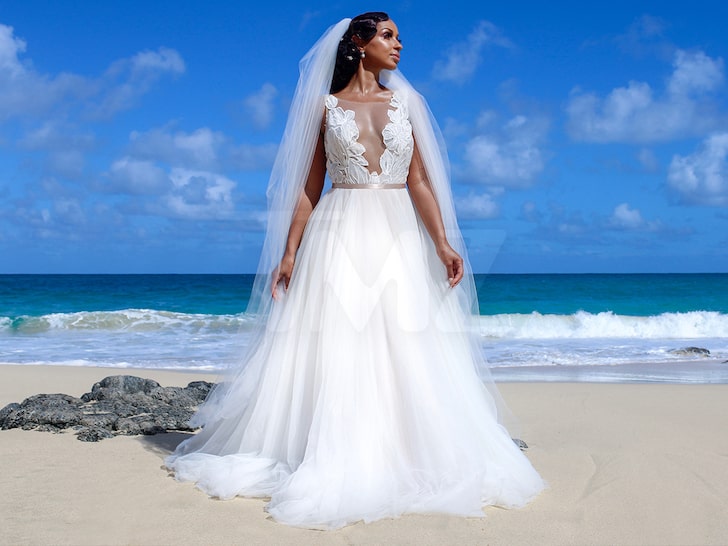 Mya - wedding dress on the beach - TMZ - d6a66c8c03ad447ea88e5d4aac5c3f95_md
