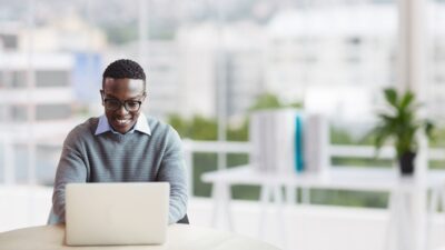 business-man-at-a-desk-using-a-computer - yay images