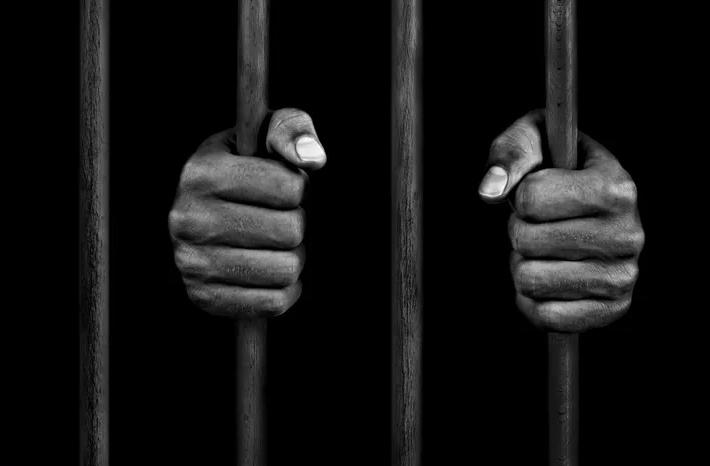 prison bars - hands