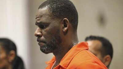 R Kelly (profile - orange jump suit)
