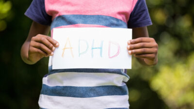 adhd - boy-showing-a-poster-with-adhd