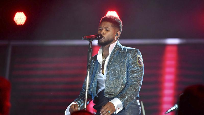 Usher performing - Getty
