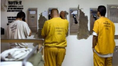 Inmates on phones / Getty