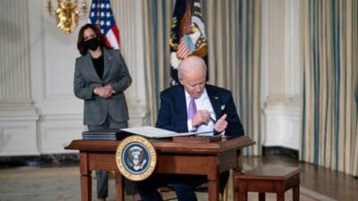 Joe Biden (Kamala Harris in bgrd) signing exec orders on race equity - Getty