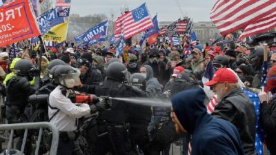 Trump supporters clash with police and security forces as they try to storm the Capitol in Washington, D.C. on Wednesday. Demonstrators breached security and entered the Capitol as Congress debated the 2020 electoral vote certification. / Getty