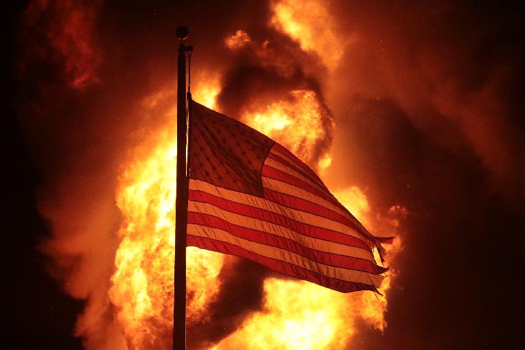 American - US - Flag-fire-behind-it-Kenosha-WI-Scott-Olson-Getty-Images
