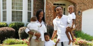 Black Family in front of new home
