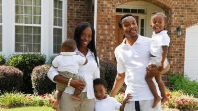Black Family in front of new home