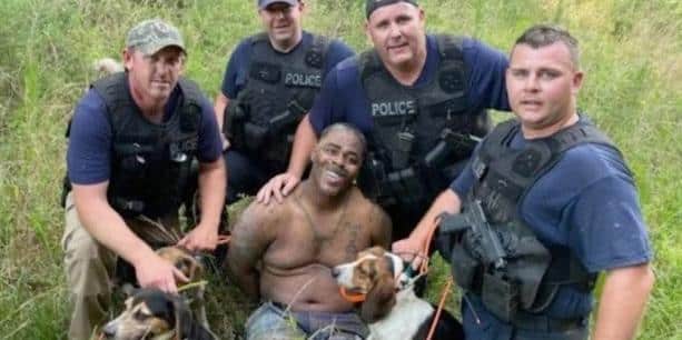 Anger Ensues After White Mississippi Cops Post Pic with Dogs and Black Suspect - Vimarsana News