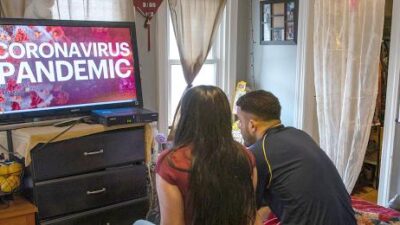 Coronavirus - couple watching TV (Getty)