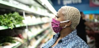 Woman wearing mask in supermarket1 - GettyImages
