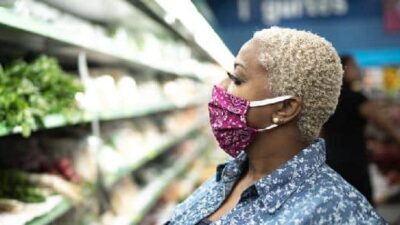 Woman wearing mask in supermarket1 - GettyImages