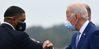 Joe Biden is greeted by US Congressman Cedric Richmond