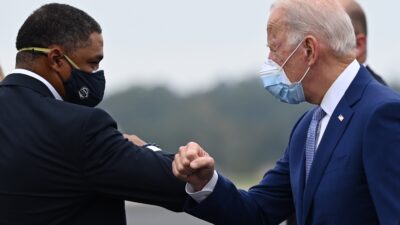 Joe Biden is greeted by US Congressman Cedric Richmond