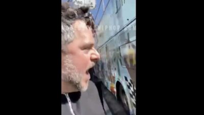 man loses it over Meek Mill's album cover on bus