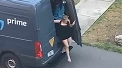 Woman sneaks out back of Amazon delivery van