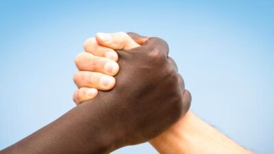 Black & White arms-handshake - Dreamstime