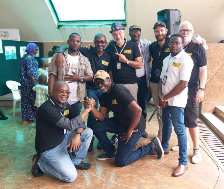 Ivory Coast - Drawing as a tool for Conflict prevention: On one knee TAYO & Zohore. Standing left to right...Kevin-Seraye-Mendoza-Caramba-KAK-Odia-Sylvain-Lars-and-Willy-Zekid