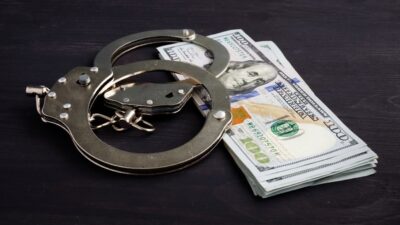 Bail - handcuffs-and-money-dollars-for-bail-bonds