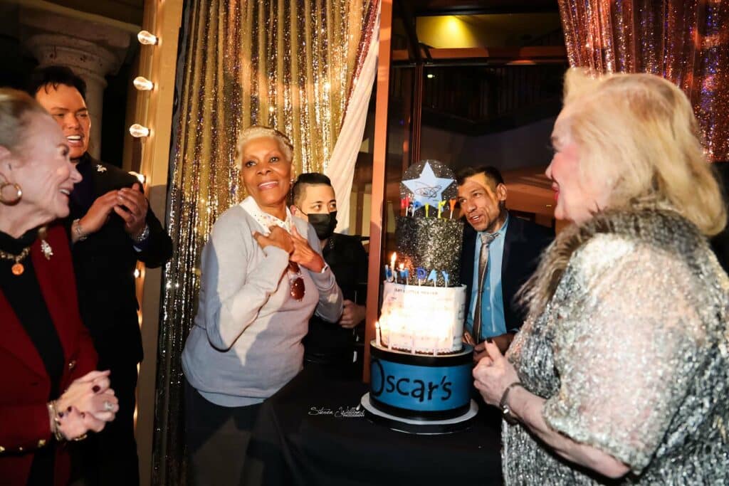 Dionne Warwick presented birthday cake at OScar's -  L to R: Juliette Mills, Tim Dunn, Dionne, Carol Connors (songwriter)  / Photo: Steven Williams