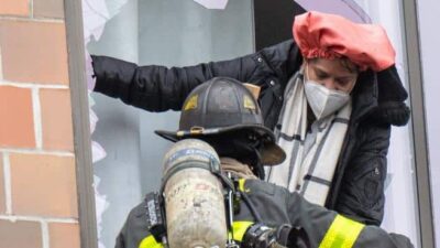 Bronx fire - Firefighter helps resident escape / Getty