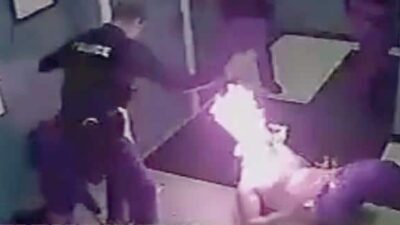 Jason Jones on fire - screenshot via NY State Atty General