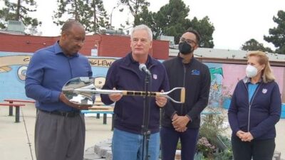 Inglewood Mayor Butts accept donation of a Golden Shovel from Jack Groh, Christopher Hicks and Susan Groh looks on: Photo Credit, Ricky Richardson