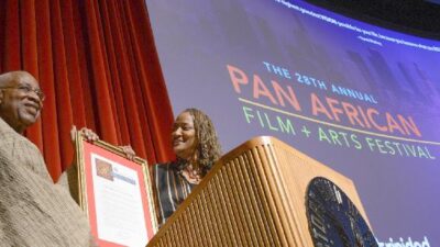 Ayuko Babu, PAFF Executive Director receives plaque from LA County Supervisor Holly Mitchell
