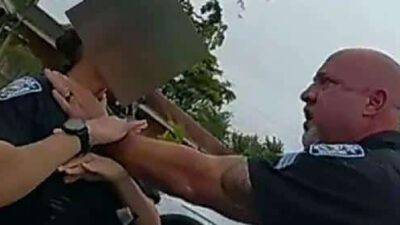 SGT Christopher Pullease grabs female officer by her throat - screenshot