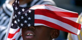 Black Child & American Flag (Getty)