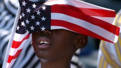 Black Child & American Flag (Getty)