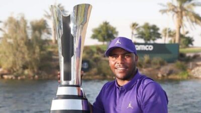 Harold Varner lll displays trophy - Getty