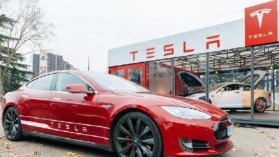 Tesla - car in front of showroom