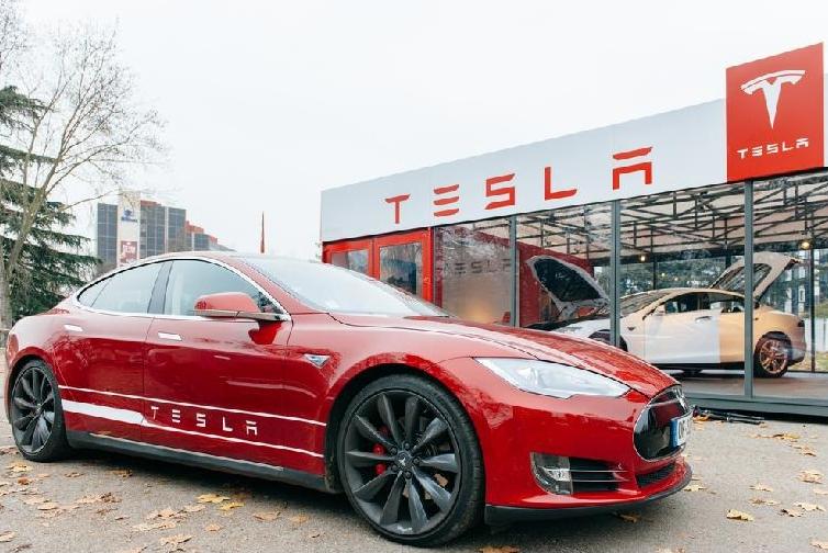 Tesla - car in front of showroom