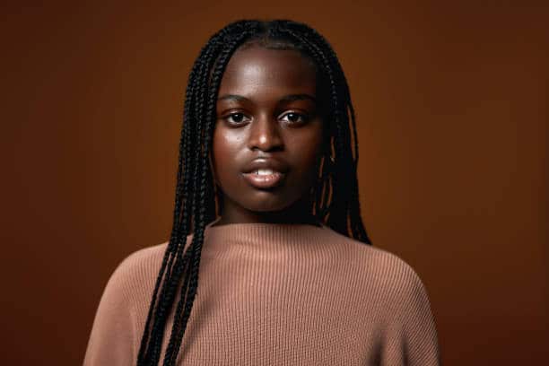 Serious black teenager (in this story) representing the unseen potential in the Black communities and the under representation in Stem fields.