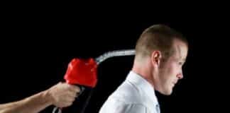 Gas pump - Man with Gas Nozzle (gun) -trigger to head