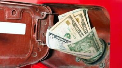 Gas pump - money in gas hole-chute for car