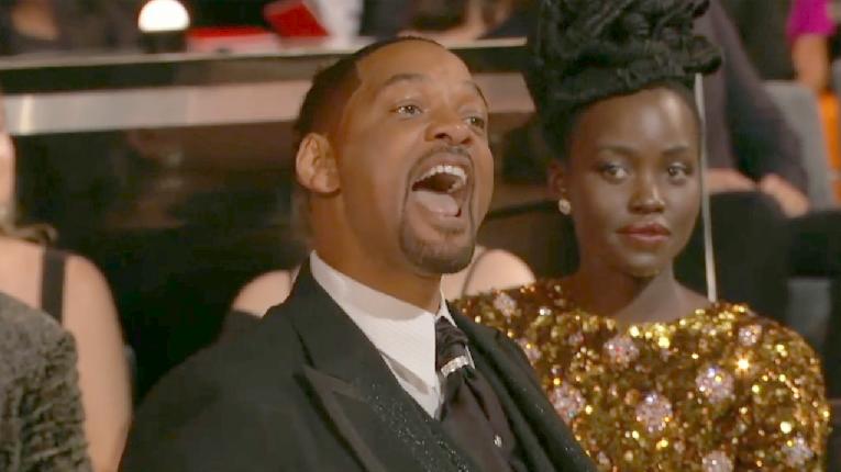 Will Smith cursing at Chris Rock at 2022 Oscars (Lupita Nyong'o looks on) - screenshot