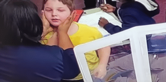 student choking in video