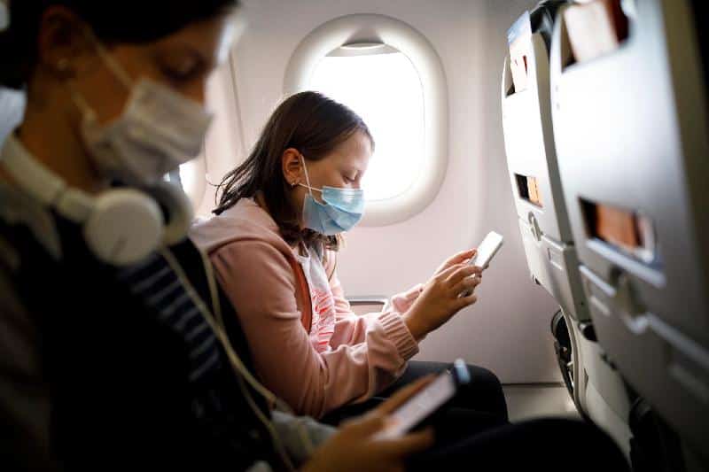 Airplane Passengers Wearing Masks - (Getty)