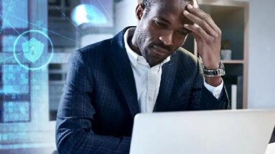 Black Technology Developer at laptop - Getty