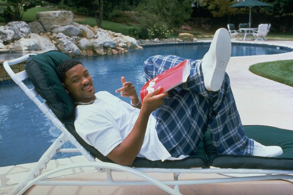 Will Smith sitting in a lounge chair by the pool at his home in Los Angeles, CA in 1996.