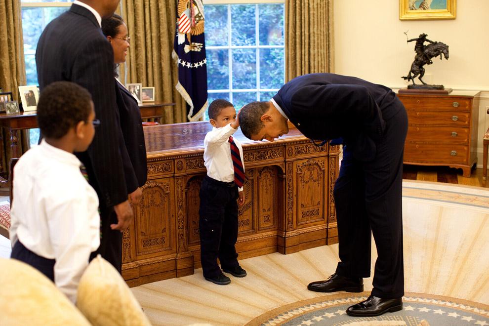 Barack Obama and lil boy touching his head - The White House - Getty