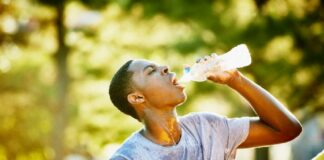 Man drinking water in heat