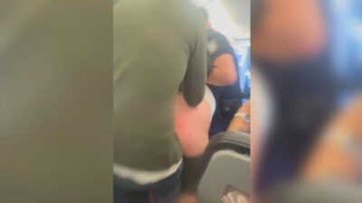 Man removed from plane after peeing on his brother