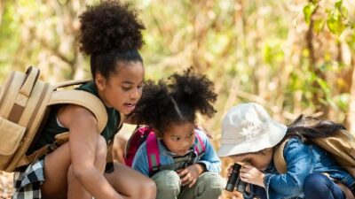 Pretty little girls in forest setting - GettyImages
