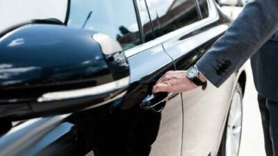 man opening car door