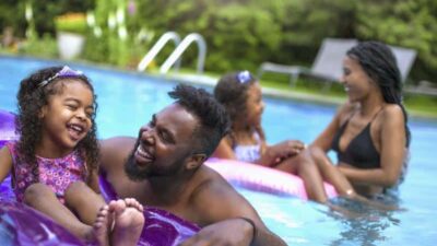 Black Family in pool - GettyImages